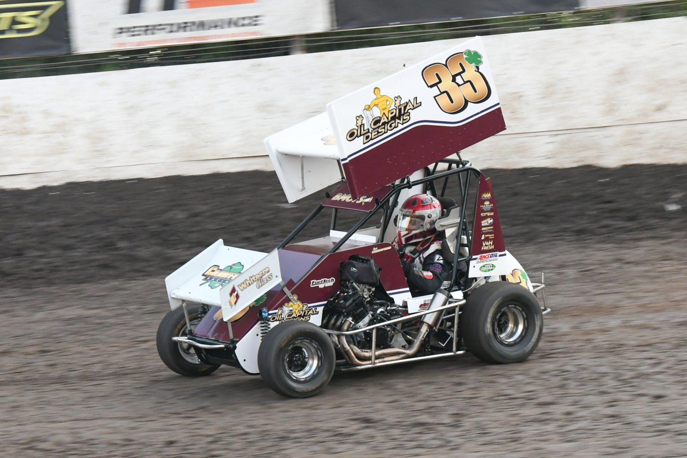Chris Crawford racing his #33 micro sprint car on a dirt track